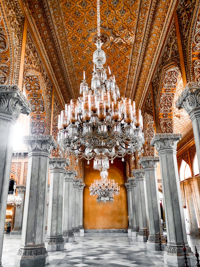 Luxurious and ornate palace interior with chandeliers in Hyderabad, India.