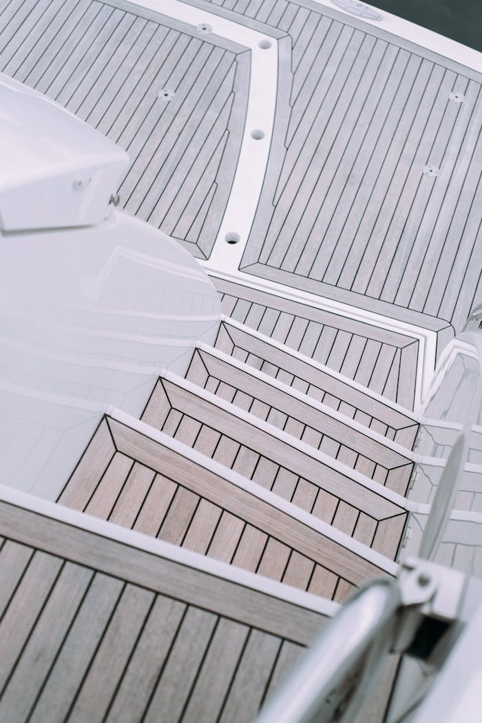 A detailed view of elegant wooden stairs on a luxury yacht deck.